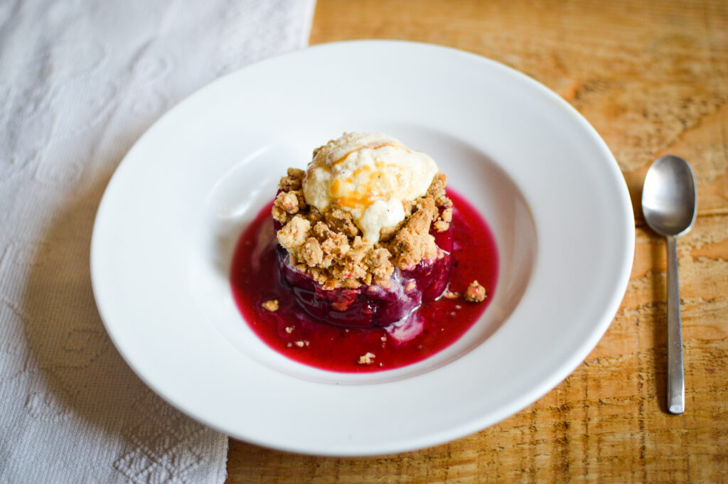 Winterberry nut crumble with orange zester creme fraiche